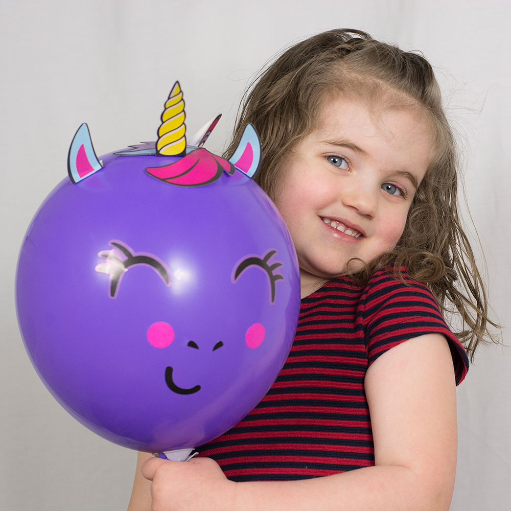 Photo of girl with balloon by Jessika Digital